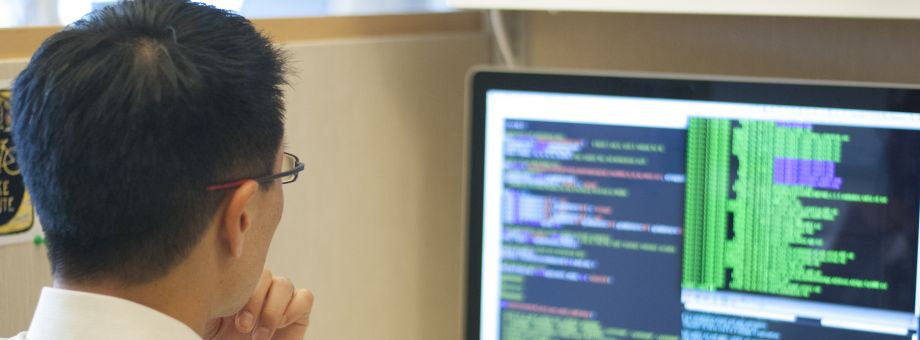 Sam Oh reviewing data on a computer screen