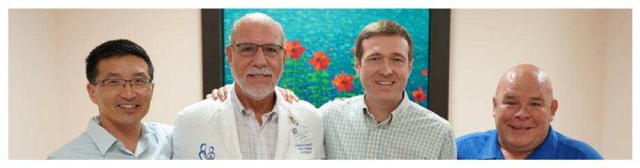 The chief architects of PRIMERO from left to right, Sam Oh, PhD, MPH, José Rodríguez Santana, MD FAAP, FCCP, Max Seibold, PhD, and Esteban Burchard, MD, MPH standing in front of a painting