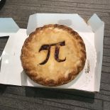 a pie with a pi symbol cut out of the crust.