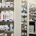 Medication bottles on shelves in a pharmacy