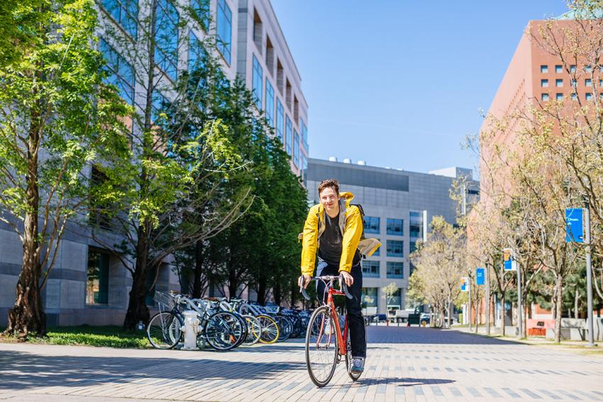cyclist biking through a quad