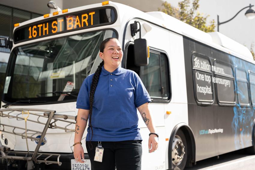 woman standing in front of a shuttle