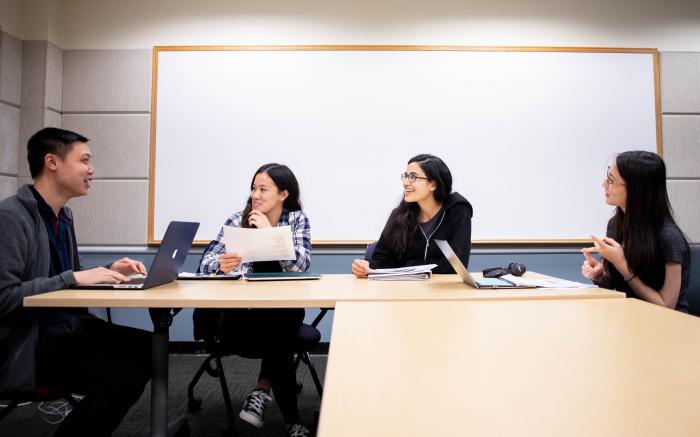 four students in a classroom