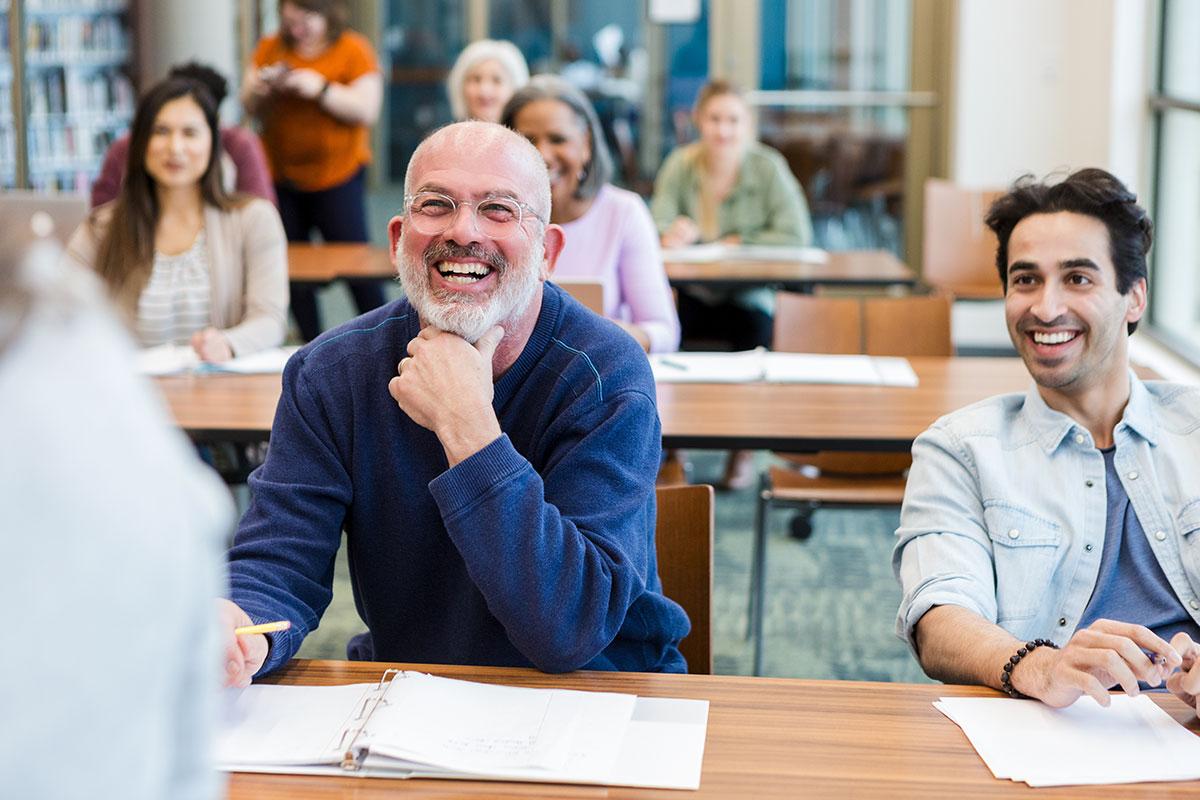 two smiling students in classroom